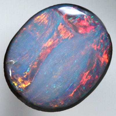 SOLID BOULDER OPAL Bright red rolling flashes in a unique pattern